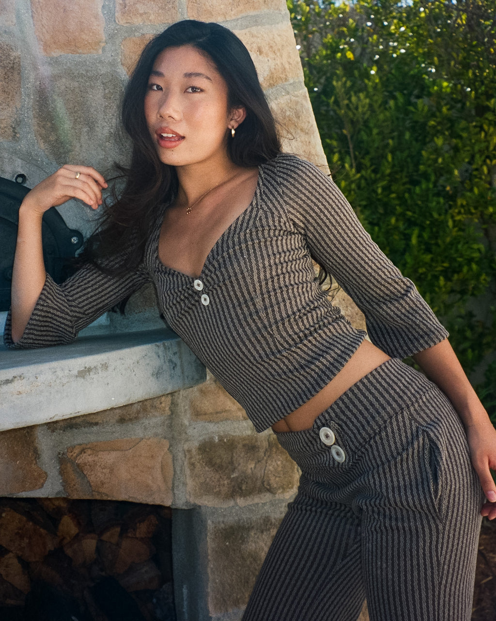 Close up of mother of pearl button detail on The Tresaire 3/4 Sleeve handmade top